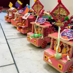 Celebrate the spirit of Lohri with these unique, handcrafted truck-themed 'mithai' boxes. They are a fun and festive way to gift sweets during the harvest festival.