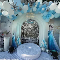 Let it go, let it go! I created a winter wonderland for a 'Frozen' themed party, complete with a sparkling sequin backdrop, character cutouts of Elsa and Olaf, and faux snow for a truly immersive Arendelle experience.