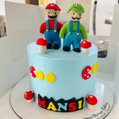 Okey-Dokey, it's a Mario cake. This cake brings the classic video game to life with handcrafted fondant figures of Mario and Luigi, complete with mushrooms and other game elements.