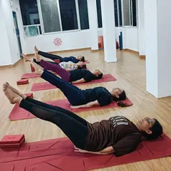 Lowering the legs in a variation of Uttanpadasana. This controlled movement is fantastic for building deep core strength and toning the abdomen.