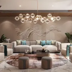 This living space features a custom bas-relief wall sculpture, adding a layer of artistic texture. The combination of plush sofas and armchairs in neutral and teal tones creates a sophisticated yet inviting atmosphere for family and guests.