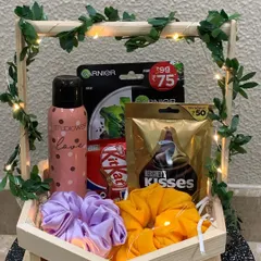 For a more rustic and charming feel, I offer the hexagon wooden basket. It's a unique shape, and the handle wrapped in ivy and lights adds a whimsical touch.