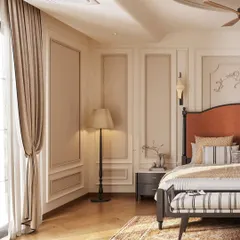 Natural light streams into the neoclassical bedroom, highlighting the herringbone wood flooring and the soft texture of the curtains. A floor lamp and elegant side table create a cozy reading corner next to the bed.
