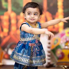Another shot of this little cutie showing off her Garba moves. I make sure to capture a variety of poses and expressions during these energetic festive baby photoshoots.