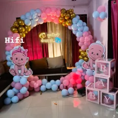 Welcoming a new baby is a precious moment. We designed this charming and modern baby shower decor for an at-home celebration, featuring a pink and blue balloon arch, cute baby cutouts, and custom neon signage for that perfect photo backdrop.