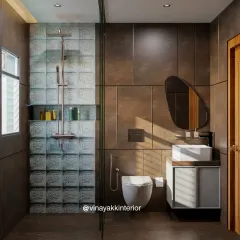 This bathroom design creates a warm, earthy feel with rich brown wall tiles and a textured glass block accent wall in the shower. The floating vanity and wall-mounted toilet help make the space feel larger and easier to clean.