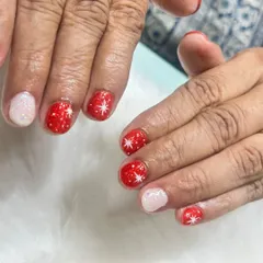 Getting into the Christmas spirit with this cute and festive design. I used a sparkly red base with hand-painted white stars, paired with a shimmering white accent nail for a classic holiday look.