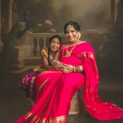 I love it when older siblings join the shoot. This is from my special painting-style saree session, where we blend tradition with fine art to create a timeless masterpiece for your family to cherish.