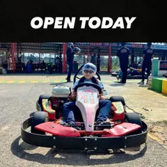 Our track is open and ready for racers of all sizes. This young driver is all set to experience the thrill of go-karting.