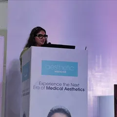 Speaking at the podium during the Aesthetic Medicine conference. My goal is always to bridge the gap between complex science and patient understanding, ensuring conversations are empowering and lead to responsible skincare choices.