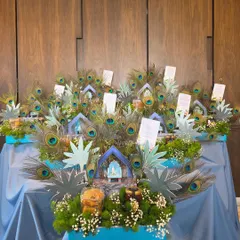 A wider view of the "Little Kanha" themed baby announcement hampers, set up for distribution at an event. The display shows the impressive visual impact of multiple, coordinated gifts arranged together.