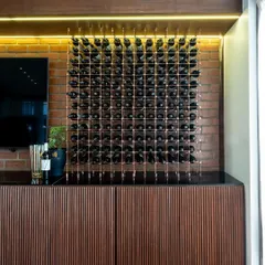 This is the 'Boutique de la Reserve', where rustic charm meets refined elegance. The brick wall, wooden ribbed counter, and our exquisite wine display create an unforgettable atmosphere for you to explore and purchase our collections.