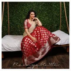 A classic bridal look with a rich cherry red Benaras lehenga featuring silver buti work. Paired with a contrast embroidered blouse and a light tulle dupatta, it's a perfect blend of tradition and elegance.