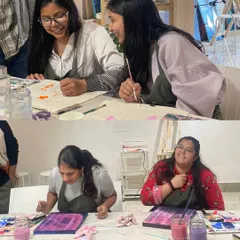 Laughter is a key ingredient in our team bonding workshops. These colleagues are sharing a fun moment while working on their individual art projects side-by-side.
