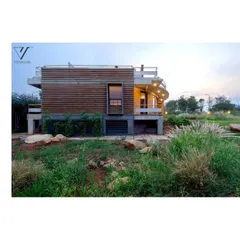 The residence at dusk, where the design's engagement with the landscape is clearly visible. The minimal hard lines and thriving softscape demonstrate my principle of letting nature lead.