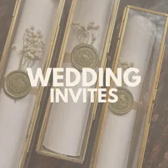 For a touch of timeless elegance, I create these scroll invitations housed in beautiful glass and brass boxes. They are adorned with dried flowers and a custom wax seal for a royal feel.