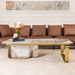A closer look at the spectacular patterns in the artificial marble top of this rectangular coffee table. The gold-accented stainless steel frame provides a sturdy and luxurious foundation, making it a perfect fit for a modern living room.