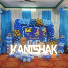 A classic Boss Baby theme for Kanishak's birthday. The blue and gold balloon arch, combined with a themed backdrop and light-up letters, creates a fun and formal look for the little boss.