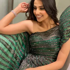 Another angle of the sparkling green gown, showing how the light catches the intricate sequin work. It's all about finding outfits that look incredible from every perspective.
