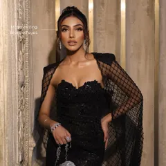 A close-up on the mesmerizing bronzed eyes, which are the star of this look. The shimmer catches the light beautifully, creating a dramatic effect.