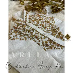 A traditional Jubba and Kacche set for a tiny toddler. The off-white raw silk is adorned with delicate gold hand embroidery on the chest.
