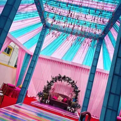 This is a wide view of the vibrant tent we set up for a Sangeet. The pink and blue drapes and colorful flooring created a festive environment for an evening of dance and music.