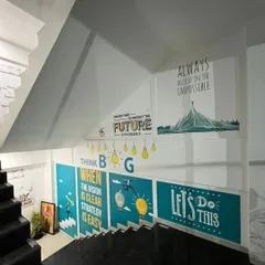 I utilize every surface to reinforce a brand's message, including stairwells. This installation uses a series of motivational graphics to create an engaging and inspiring journey between floors, promoting a positive and forward-thinking company culture.