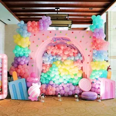 I designed this vibrant Candyland themed photo booth as a sweet spot for pictures. It features a cascade of pastel balloons pouring through an arched backdrop, surrounded by giant lollipops, ice cream props, and a custom light up sign.