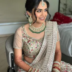 A happy bride glowing in her pastel look. This makeup was crafted to enhance, not overpower, with every detail from the sculpted cheekbones to the soft-focus skin whispering elegance.