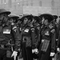 This black and white shot emphasizes the discipline and unity of the soldiers on a foggy Delhi morning. The lack of color draws attention to their expressions and the sharp lines of their formation during the parade rehearsal.
