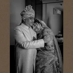 A father's embrace. This black and white photo captures the emotional and tender moment between a bride and her father on her wedding day, a memory to be cherished forever.