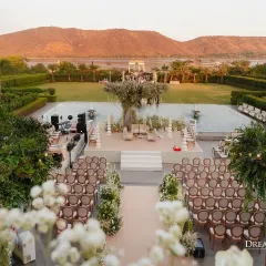 My design philosophy is about creating harmony between the setting and the ceremony. Here, an elegant, open-air mandap with a sculptural floral tree stands against the majestic backdrop of the hills, designed to feel both grand and deeply personal.