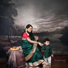 Dressed in a stunning green saree, this mother-to-be shares a tender moment with her son. Capturing maternity sessions with traditional Indian wear adds a layer of timeless elegance and cultural pride.