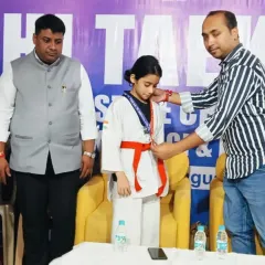 Awarding the gold medal to my student at the Delhi state championship. Seeing their hard work pay off is my greatest reward as a coach.