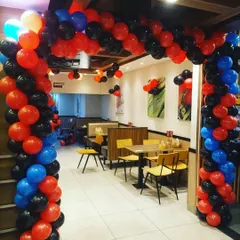 A closer look at the entrance for the racing-themed party. We built a full balloon arch in red, blue, and black to welcome guests and set the tone for the event right away.