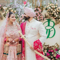 A closer look at the 'JB' monogram at this beautiful Amritsar wedding. The design becomes part of the couple's story as they share a quiet moment, with their unique emblem standing beside them.
