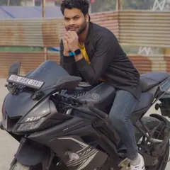 A relaxed, leaning pose on the motorcycle. This shot has a casual and confident vibe, great for a lifestyle portfolio.