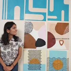 A different pose with the collection of seven abstract paintings. I love how the different styles work together to create a dynamic gallery wall.
