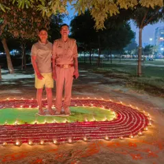 A proud moment with one of my dedicated students, standing on our running track rangoli. This is what our fitness community is all about.