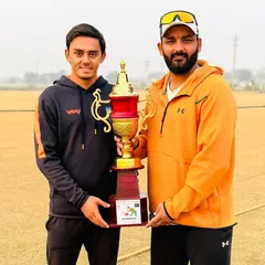 A coach and his player celebrating a well-deserved tournament victory. These moments make all the effort worthwhile.