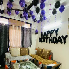 Another view of the simple living room birthday setup, showing how balloons can easily transform a space.