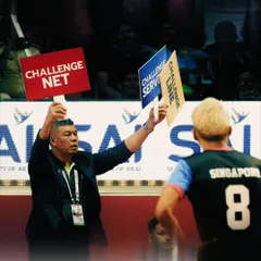 Even the officials are part of the action. This shot captures the intensity of a referee's call during a high-stakes moment in the Sepaktakraw World Cup.