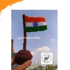 Our handmade crochet Indian flag, the Tiranga, mounted on a stand. It's a perfect decorative piece for your desk or car to show patriotic pride on national holidays.