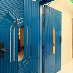 A closer look at the stunning blue PU-finished safety door, showing how the double-door design comes together. The fluted texture and curved lines make it a true work of art.