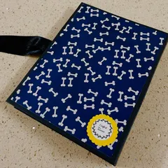 This is the back cover of our dog-themed scrapbook, featuring a playful bone pattern. We make sure every part of the album is beautifully designed.