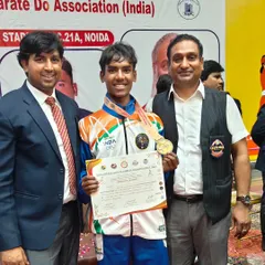 Posing with a champion. This student's outstanding performance in the national championship is a testament to his dedication.