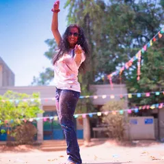 A candid moment of dance during the Holi festival. These events are all about spreading love and happiness through music and color.