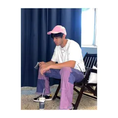 A candid shot of Anshuman Malhotra in the pink and purple outfit I styled. This look shows my approach to men's fashion, using bold colors and contemporary pieces to create memorable outfits.
