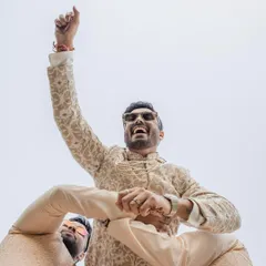 The joy of a carnival-themed wedding party. We love capturing the fun and unique events that couples plan, like this groom enjoying a Ferris wheel ride.