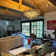 There's a moment in every project when the vision starts to become real. Here, we are unboxing and setting up the chandelier in the Saratoga home. It's a messy, exciting process, but seeing the space transform piece by piece is what we live for.